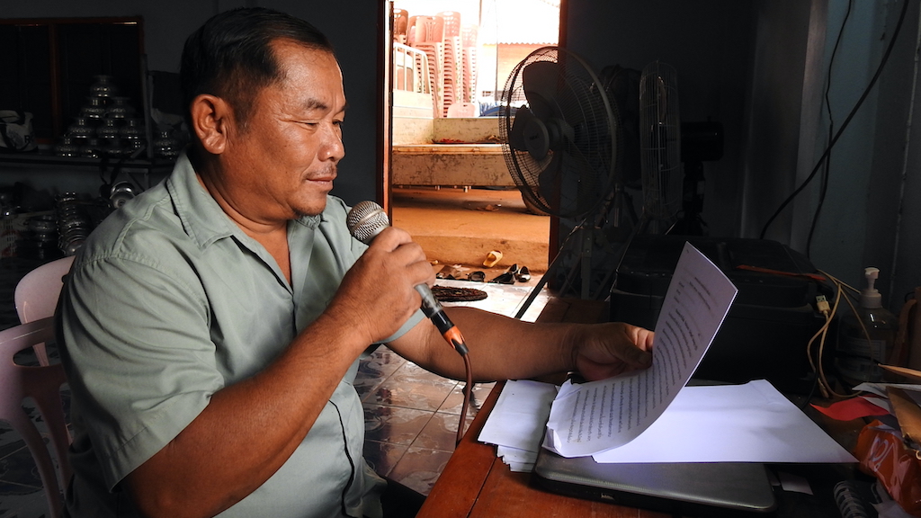 Latsamy Baopaseuth, Chief of the Dongkhuay village, maintains equipment used to deliver information and early warnings to his community to ensure they are well prepared to respond to natural disasters.